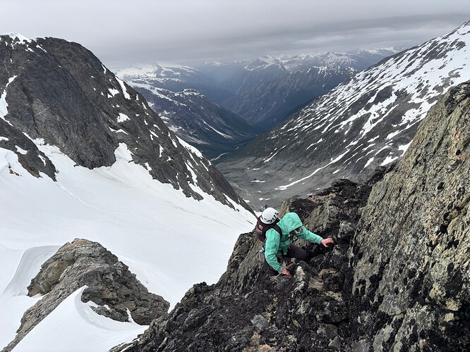 Andrea racing back up to our packs to avoid the rain