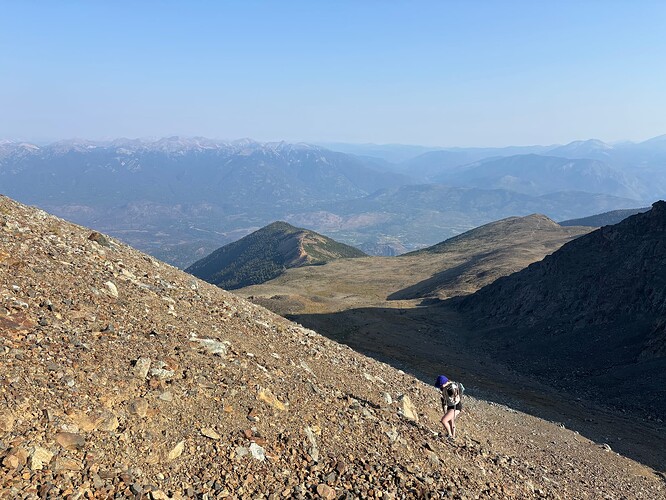 Andrea booting up the talus and scree