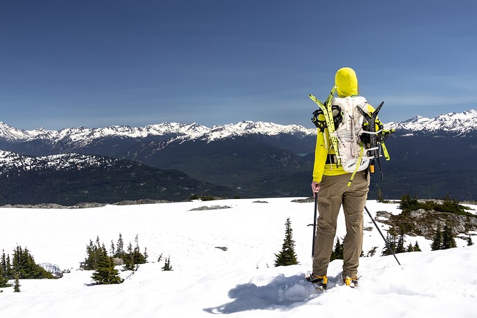 Matt enjoying the view and carrying some useless snowshoes.